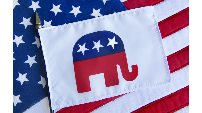 REPUBLICAN ELEPHANT SYMBOL on a flag on top of the American Flag.