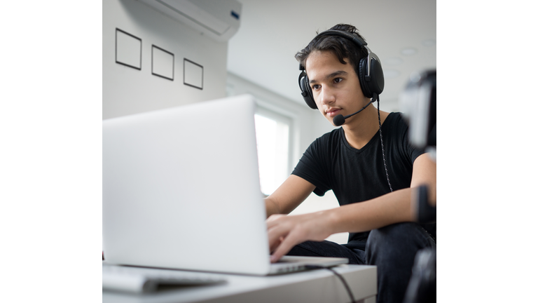 Teenage boy distance learning from home