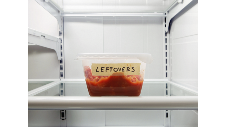 Single leftover container on refrigerator shelf