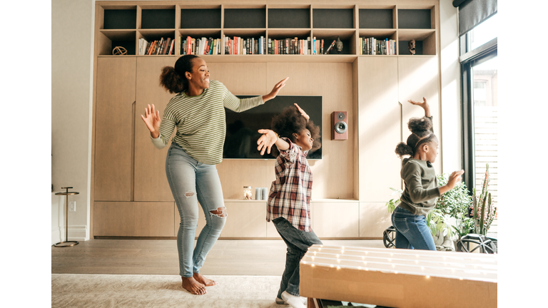 Mother and kids dancing