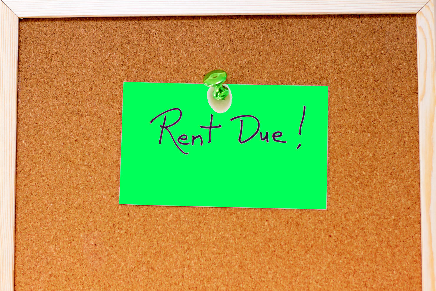 "Rent Due!" Green Sticky Note Reminder on Cork Board