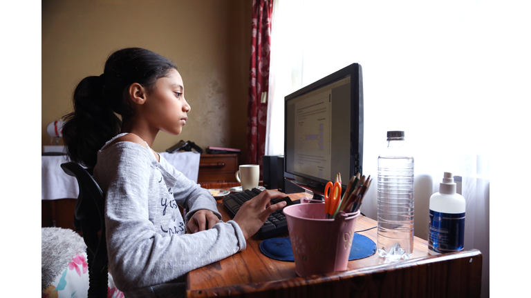 a Teenage girl doing homework.