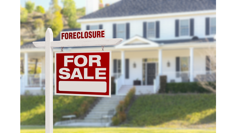 Foreclosure Home For Sale Sign in Front of Large House