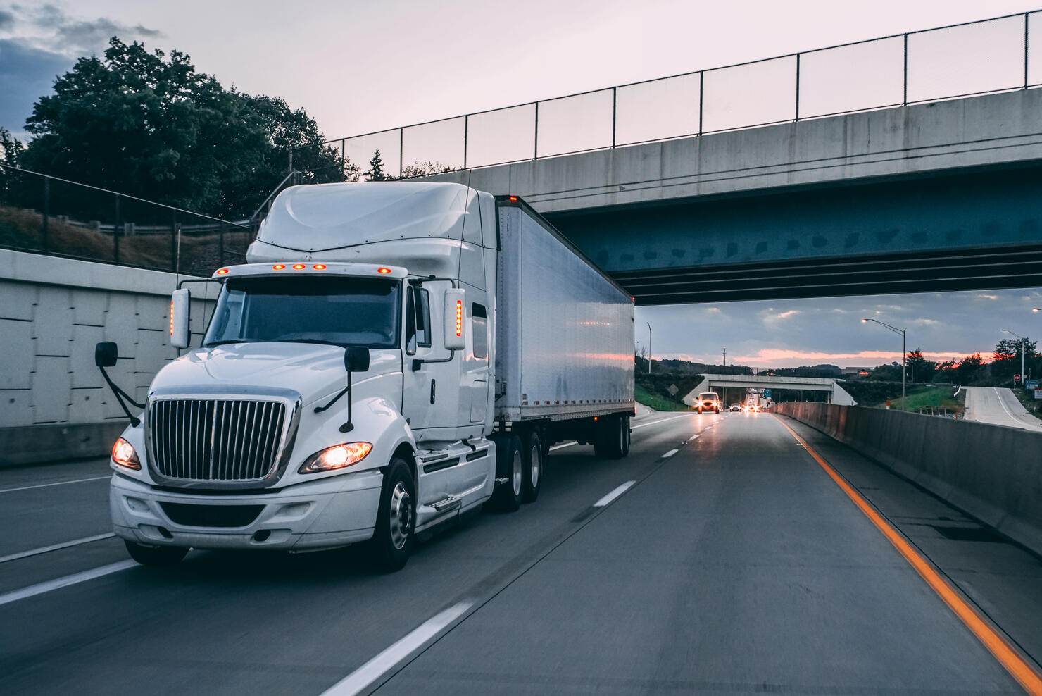 18 wheeler truck on road at night