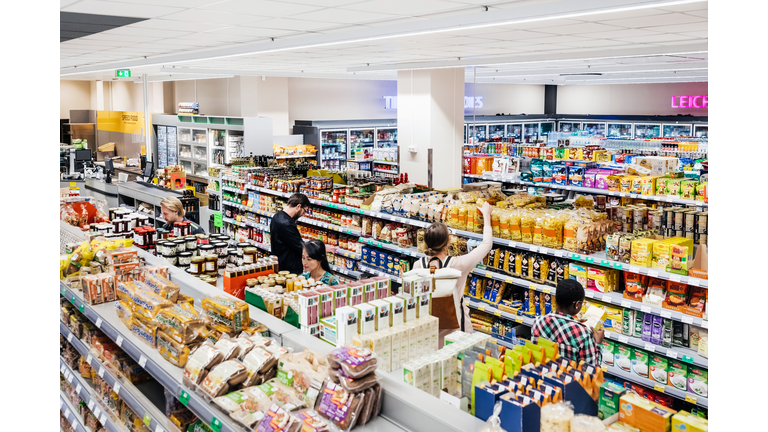 A Busy Supermarket With Customers Shopping