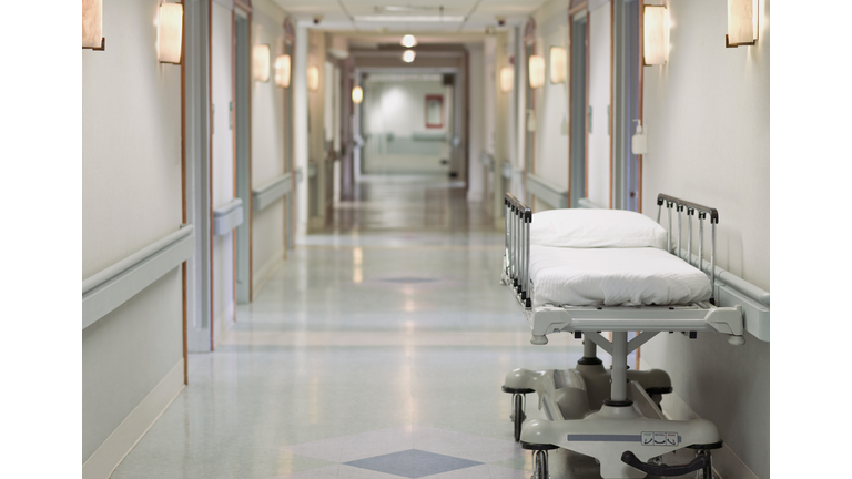 Portable hospital bed in hallway