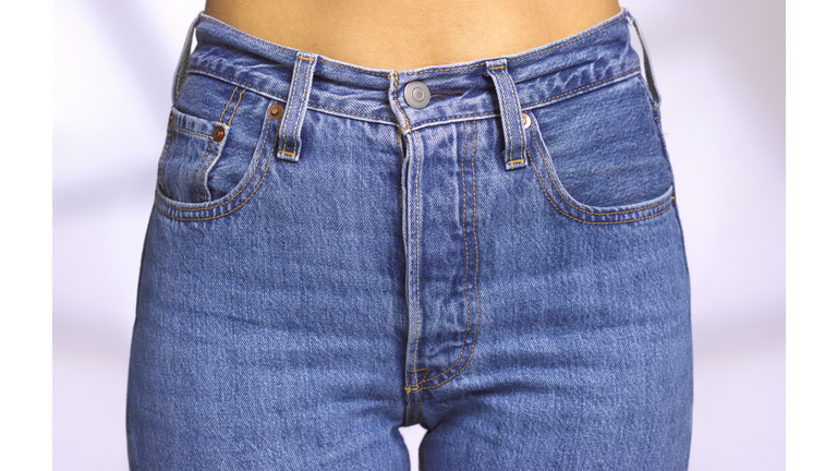 Close up of front of woman wearing denim jeans