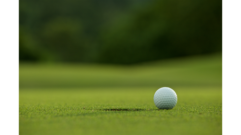 Close-Up Of Golf Ball On Playing Field