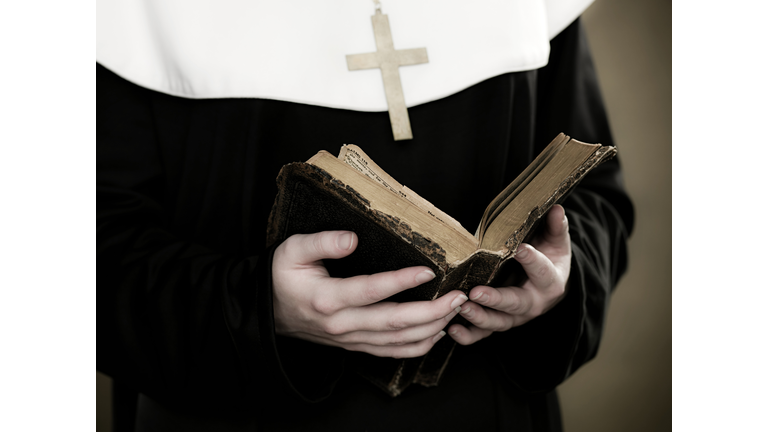 A nun holding a bible