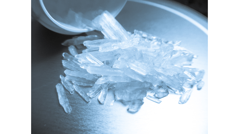 Close-Up Of Methamphetamine Jar On Table