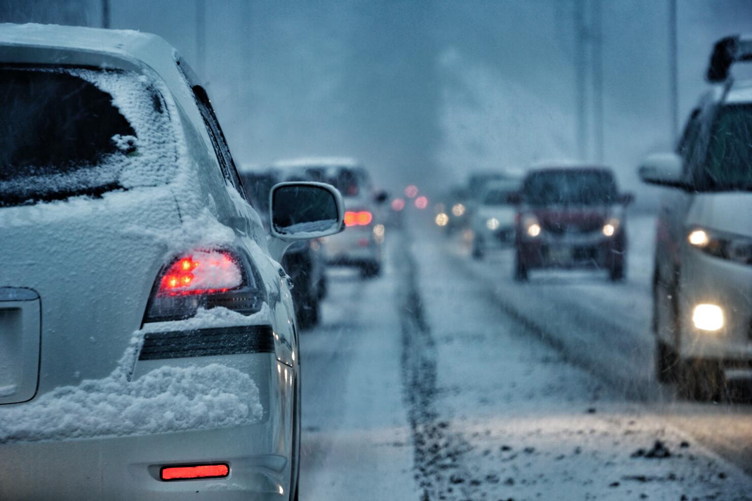 Vehicles On Street During Snowfall