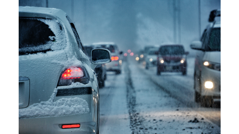 Vehicles On Street During Snowfall
