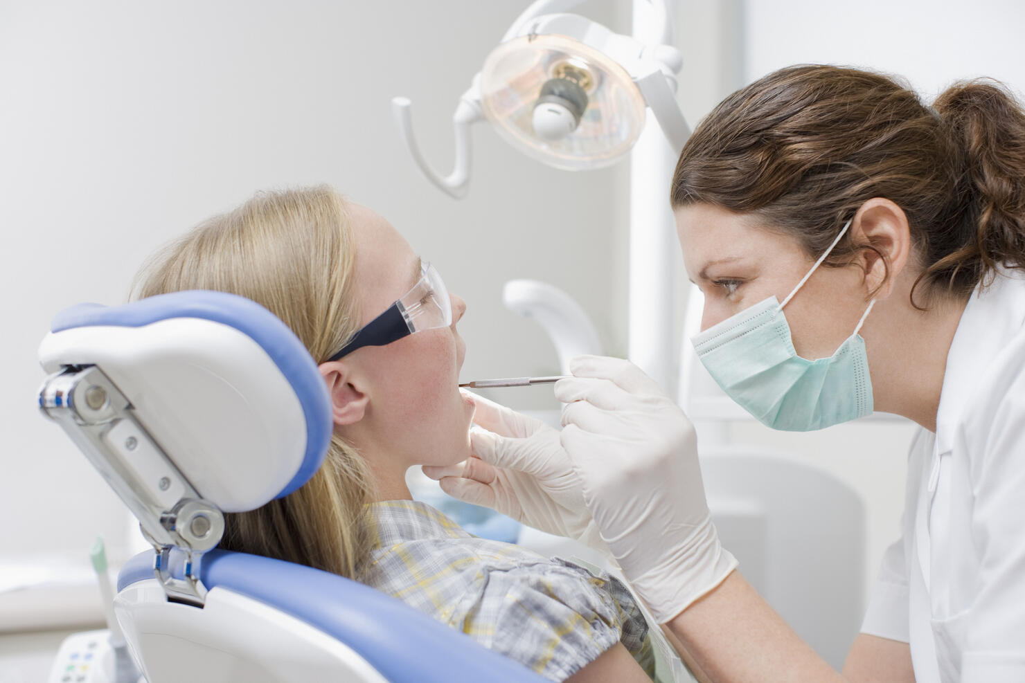 Dental hygienist working on patients teeth