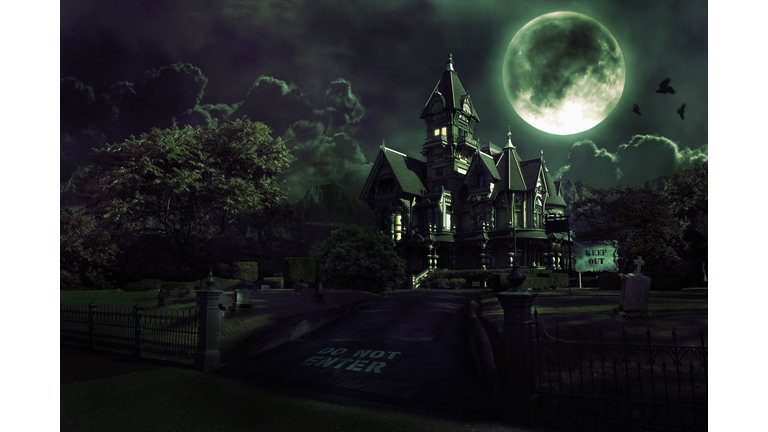 Full Moon Over Haunted House with Graveyard for Halloween