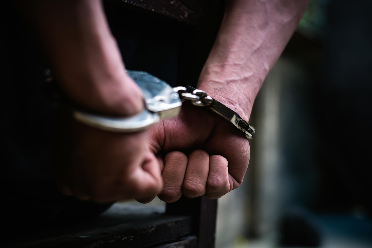 Cropped Hand Of Handcuffs