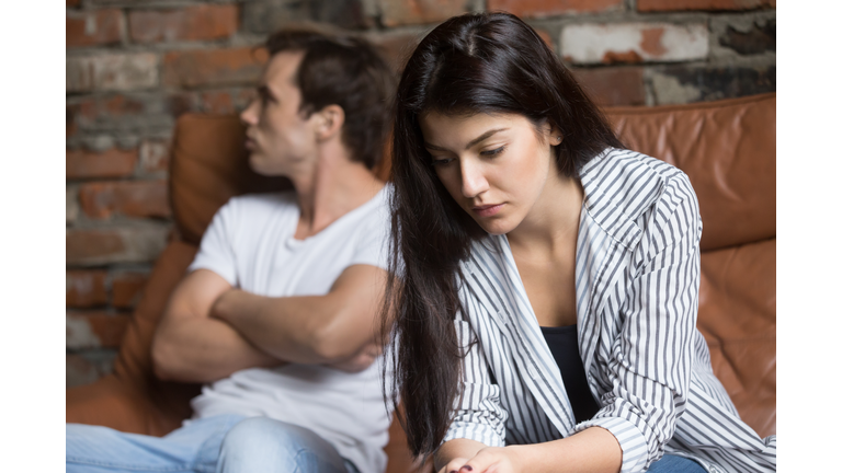 Sad pensive young girl thinking of relationships problems after fight