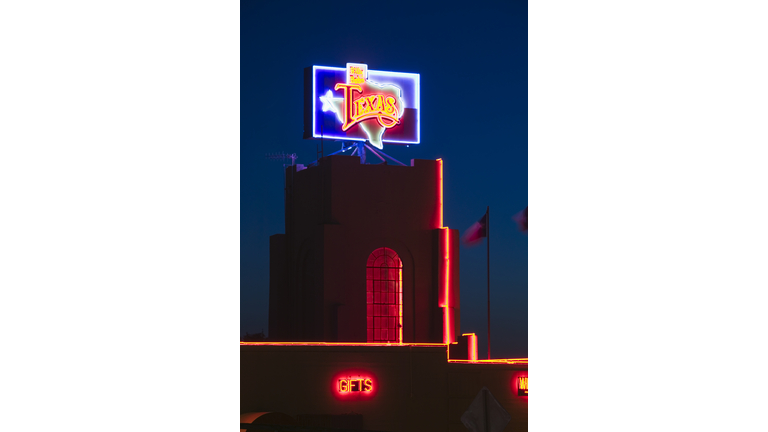USA, Texas, Fort Worth, Stockyards area, neon signs on Billy Bob's Texas venue, dusk, high section