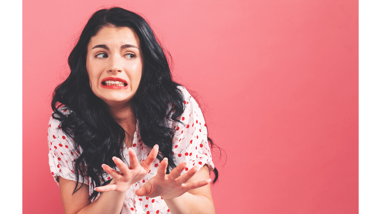 Disgusted face expression with young woman