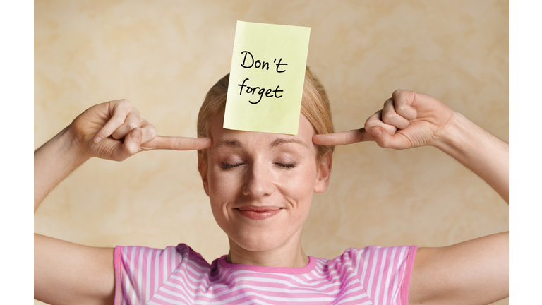 Woman committing thoughts to memory