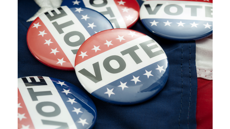 Democrat vs republican poll, democratic decision and primary voting conceptual idea with Vote election campaign button badges and the united states of american flag