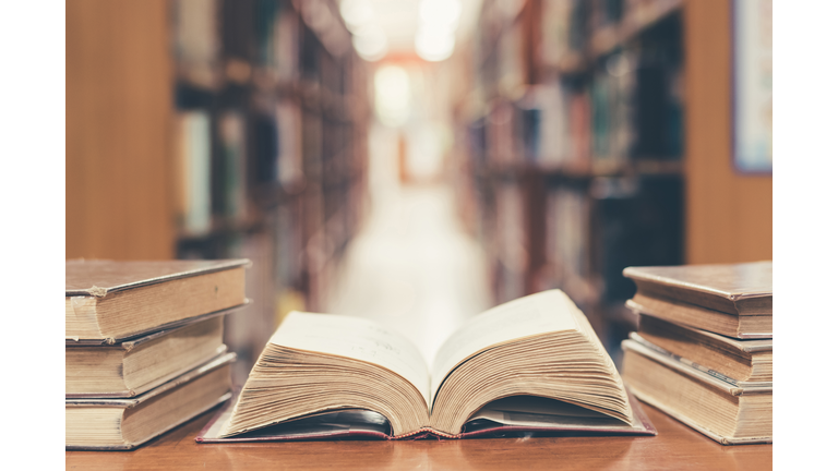 Education concept with old book in library