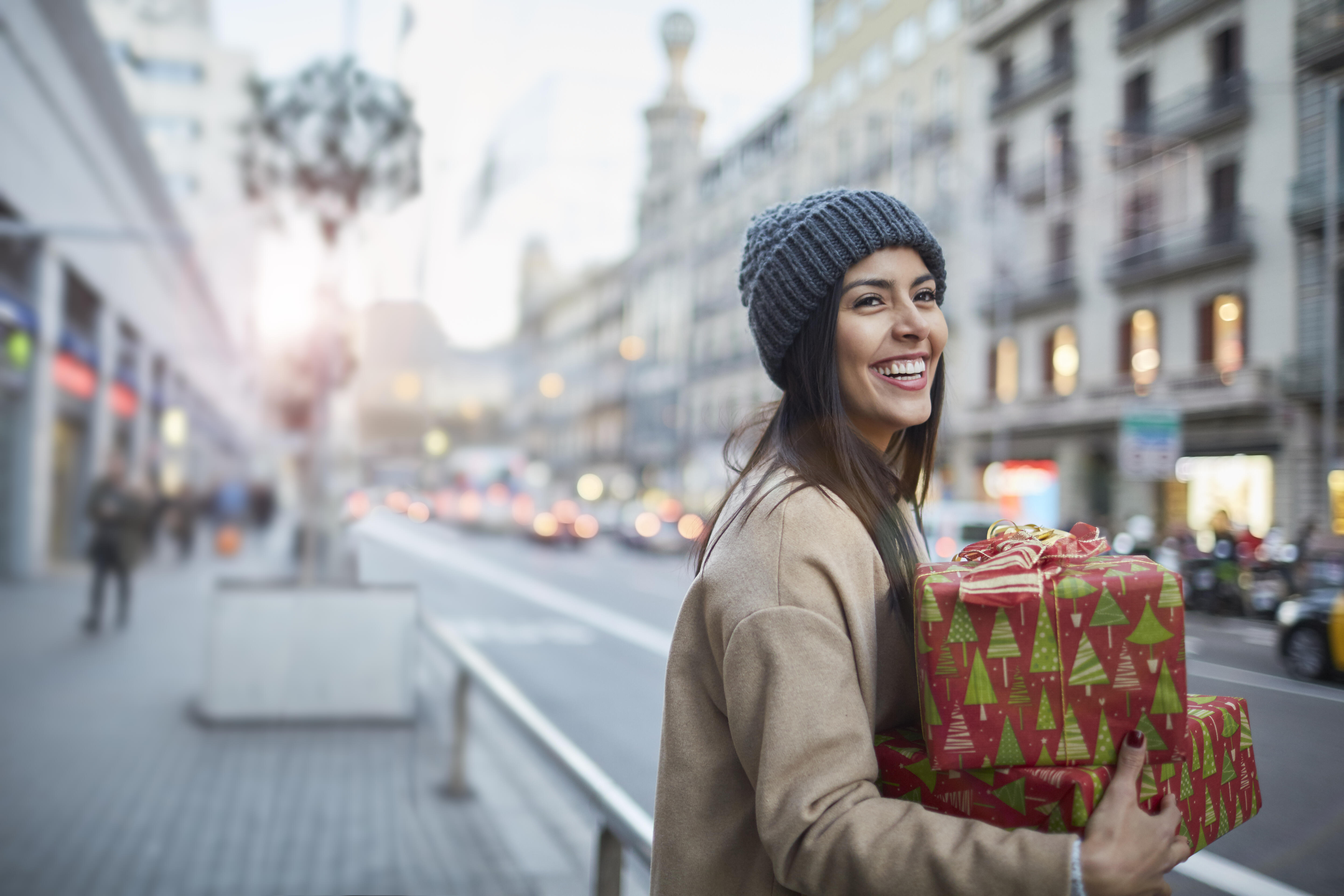 Last minute shopping. Beautiful woman Christmas shopping. Christmas shopping.