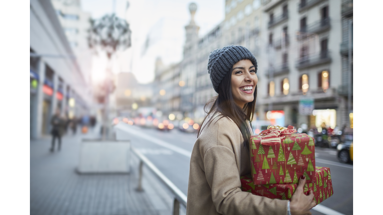 Hialing a taxi after some christmas shopping.