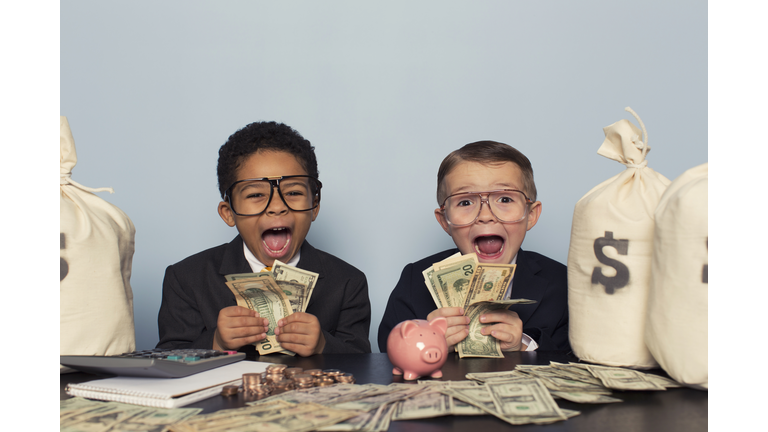 Young Business Children Make Faces Holding Lots of Money