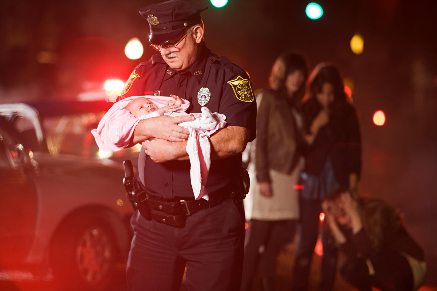 Police officer rescuing a baby