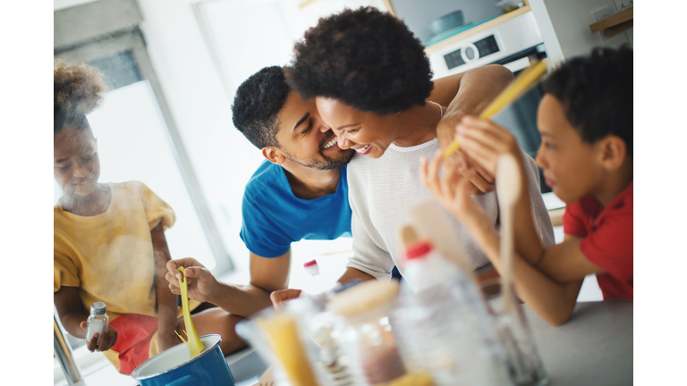 Family cooking together at home.