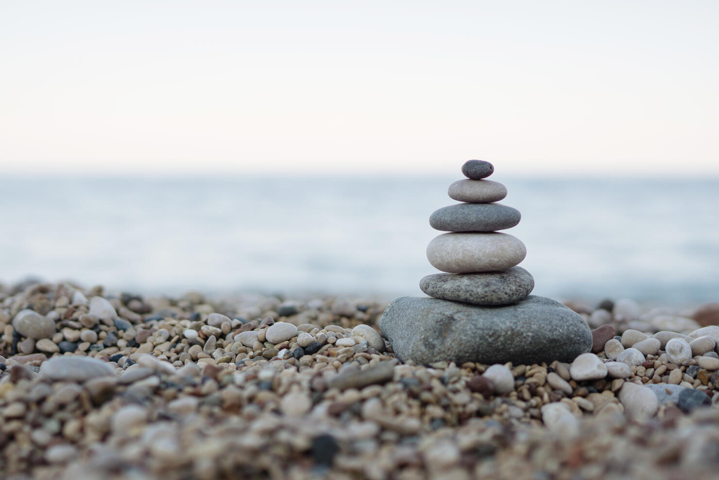 Balanced stones on a pebble beach