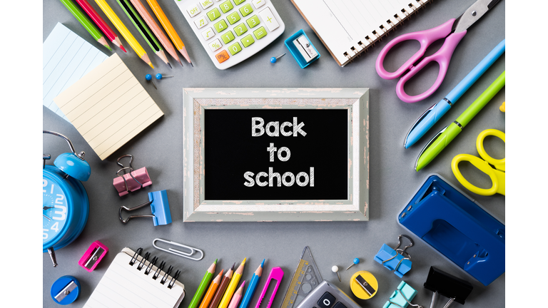 Directly Above Shot Of Writing Slate With School Supplies On Table
