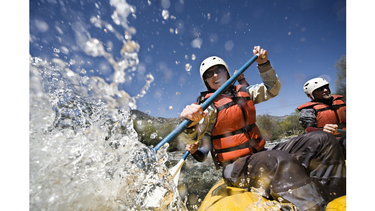 Whitewater Rafters Splashing Water