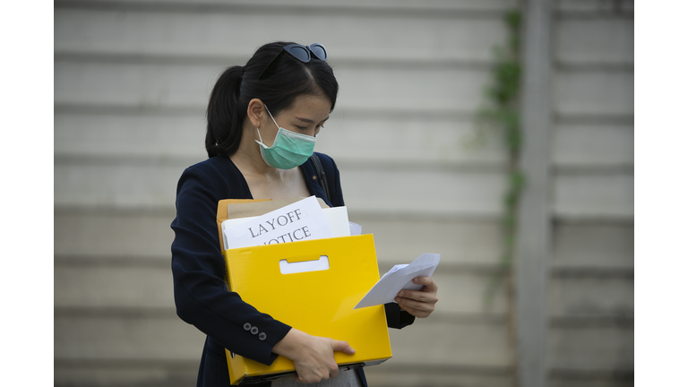 office worker feeling very sad and stress after in Coronavirus spread or Covid-19 lockdown, and company are layoff staff and recession business at covid-19 period.