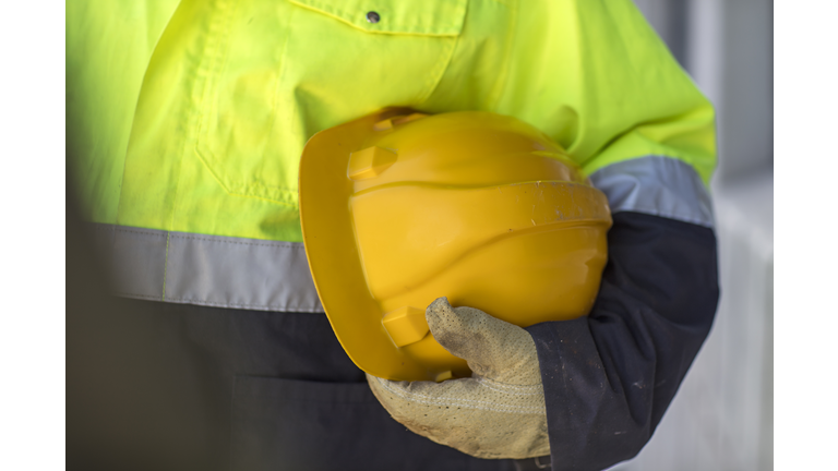 South Africa, Cape Town, Builder holding hard hat