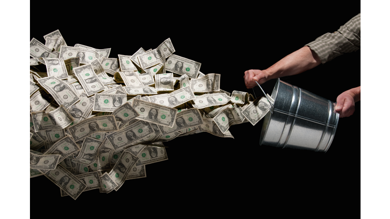 Throwing bucket of money