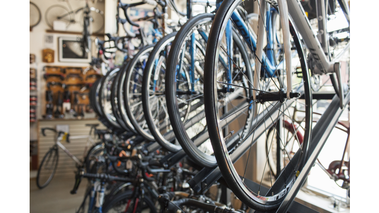 Bicycles hanging on rack in store