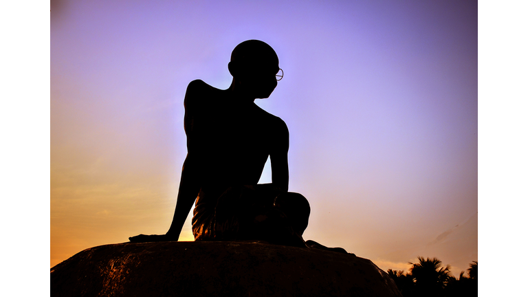 Silhouette Of Mahatma Gandhi Statue Against Sky