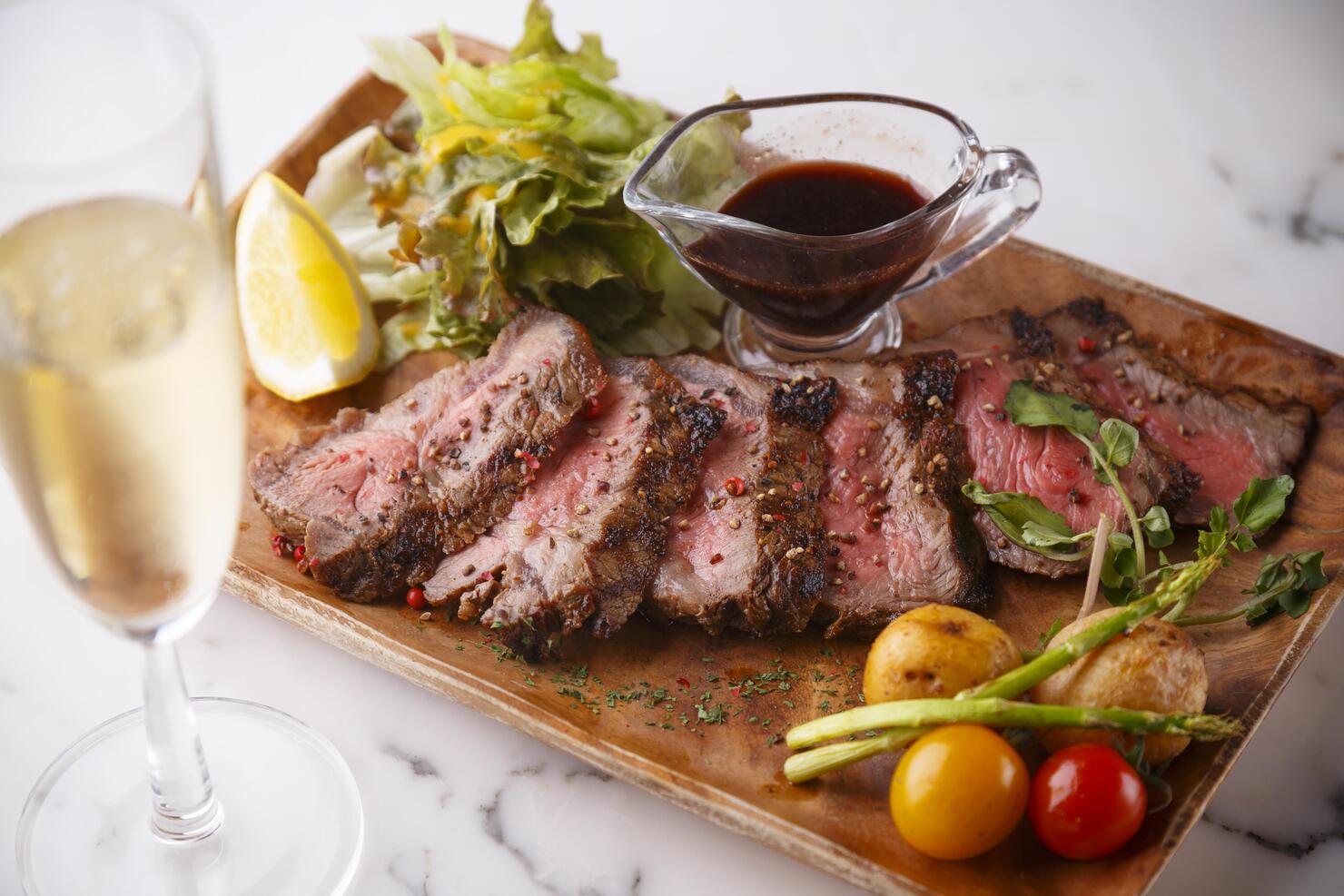 Steak , grilled beef with vegetables on the wood plate