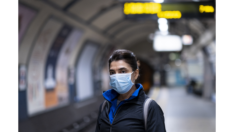 Woman wearing a mask on the London subway or tube