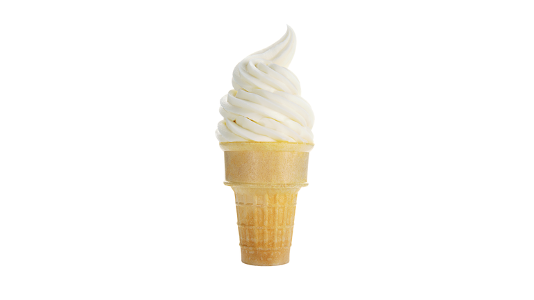 Close-Up Of Vanilla Ice Cream Cone On White Background