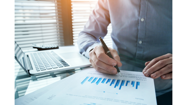 investor analyzing finance estimation charts, financial analytics