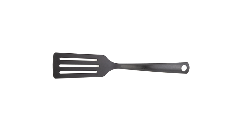 Close-Up Of Spatula On White Background