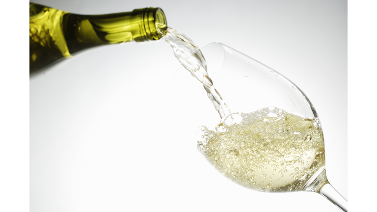 White wine pouring into glass