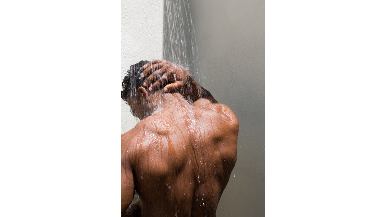 male back under the shower