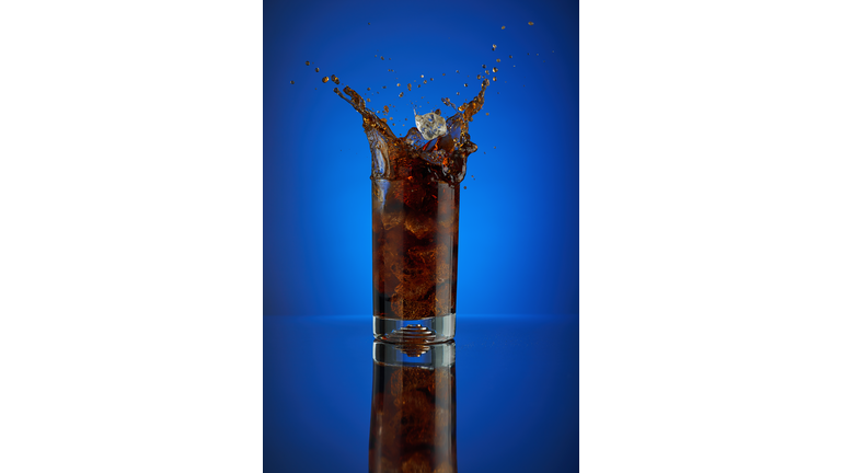 Pepsi cola splash on a blue background.