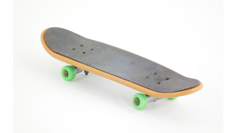 Close-Up Of Skateboard Over White Background