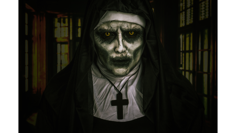 Portrait Of Young Woman Wearing Demon Nun Costume During Halloween
