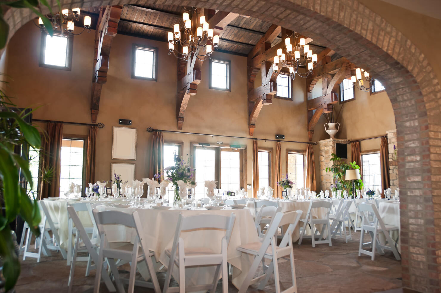 Spanish style restaurant with white chairs and tables