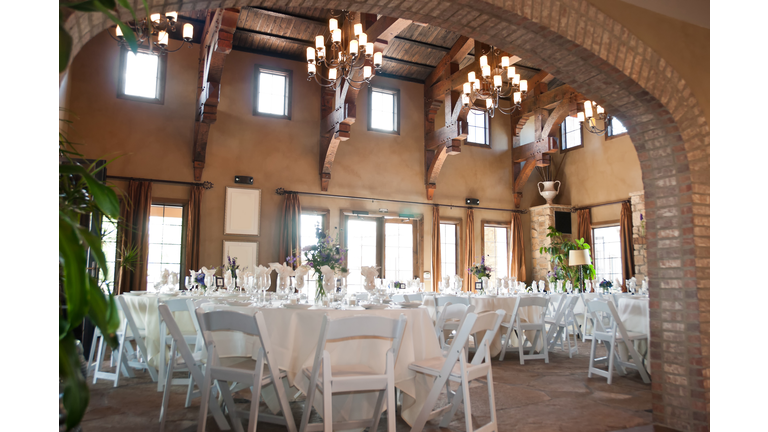 Spanish style restaurant with white chairs and tables